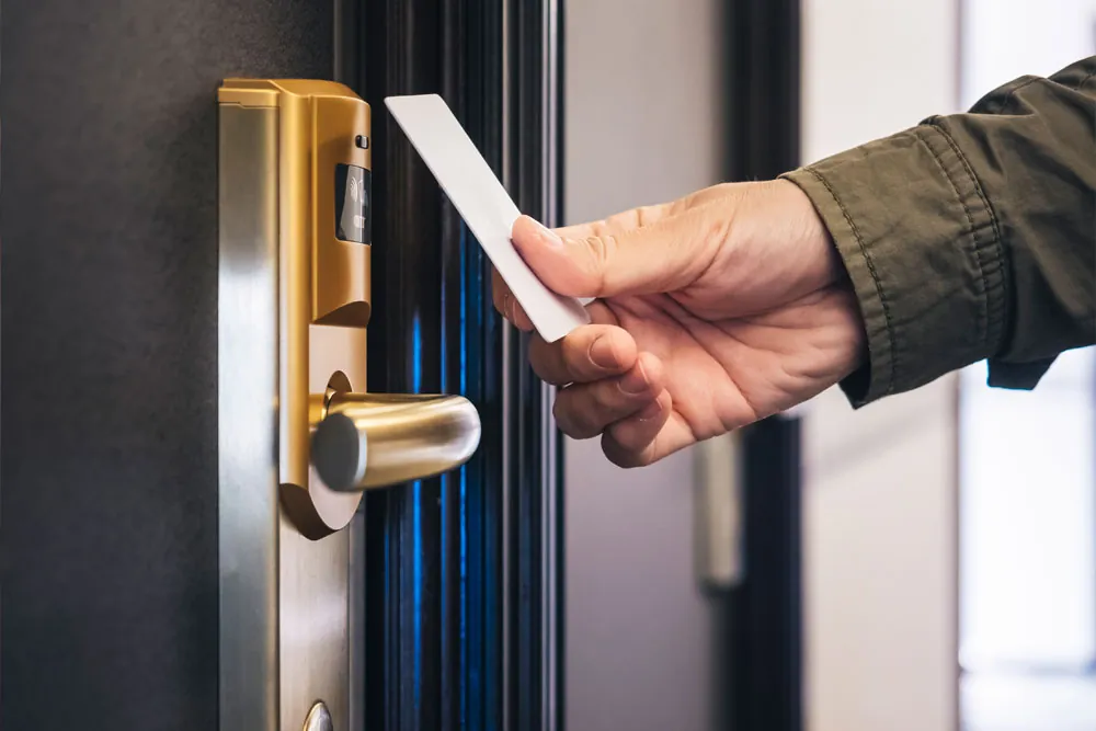 Key card held to an electronic keyless entry door lock